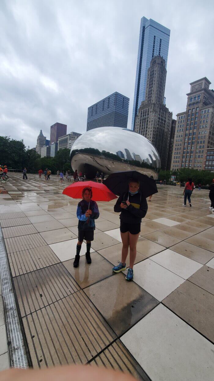 Author's kids at the Bean sculpture in Chicago's Millennium park on a rainy day